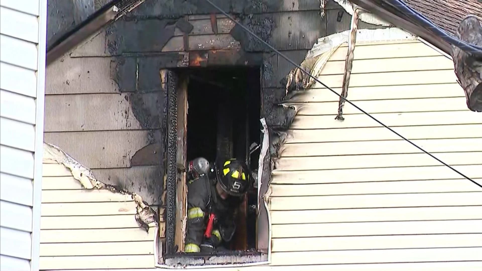 Authorities: Man killed leaping from burning building; went back inside to help others