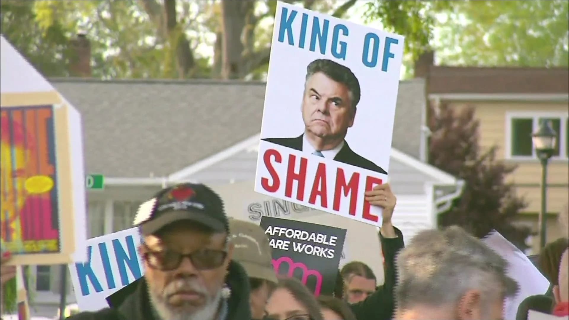 Health care protesters rally in front of Rep. King's Seaford home