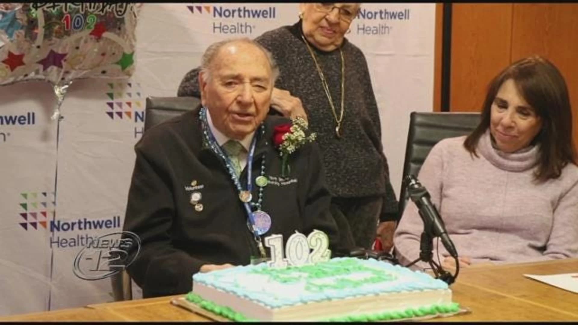 WWII vet, volunteer gets surprise 102nd birthday party