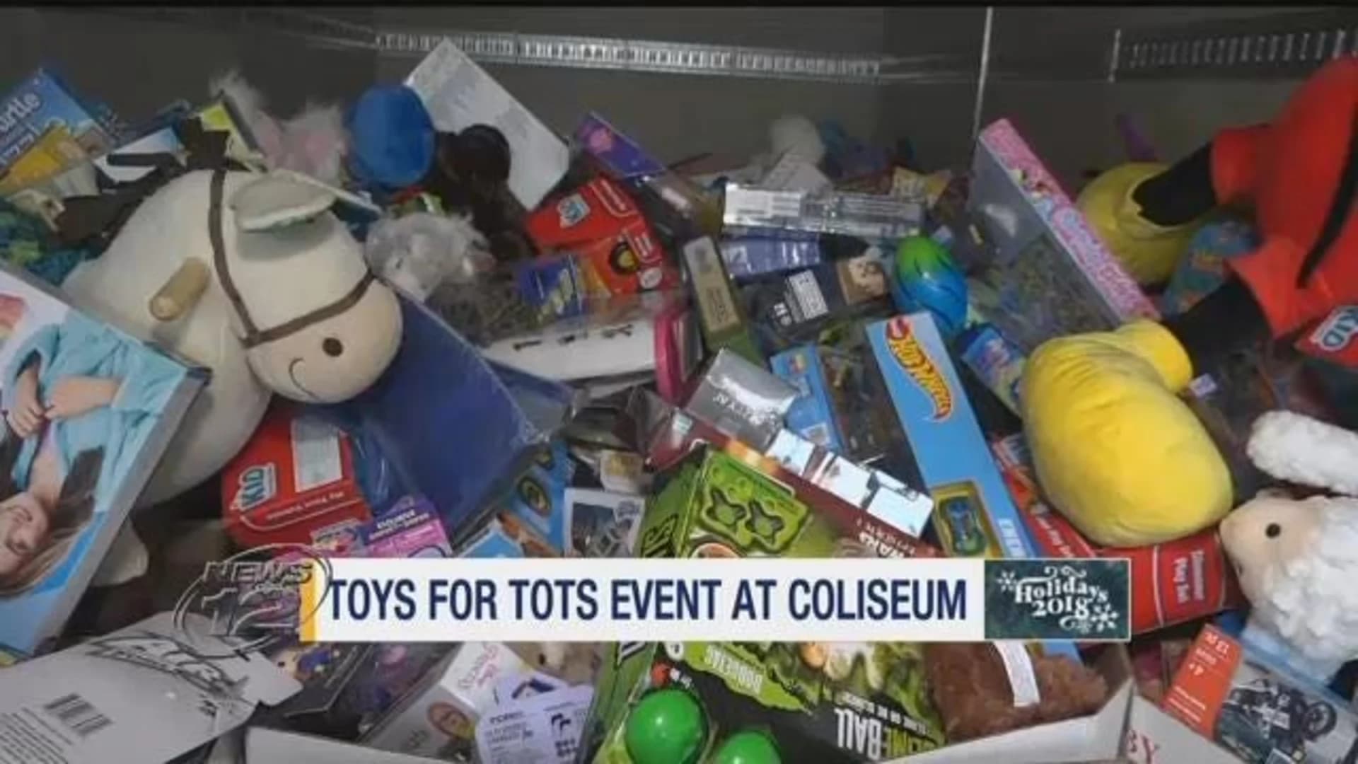 Making spirits bright: Truckloads of donated toys collected at Coliseum