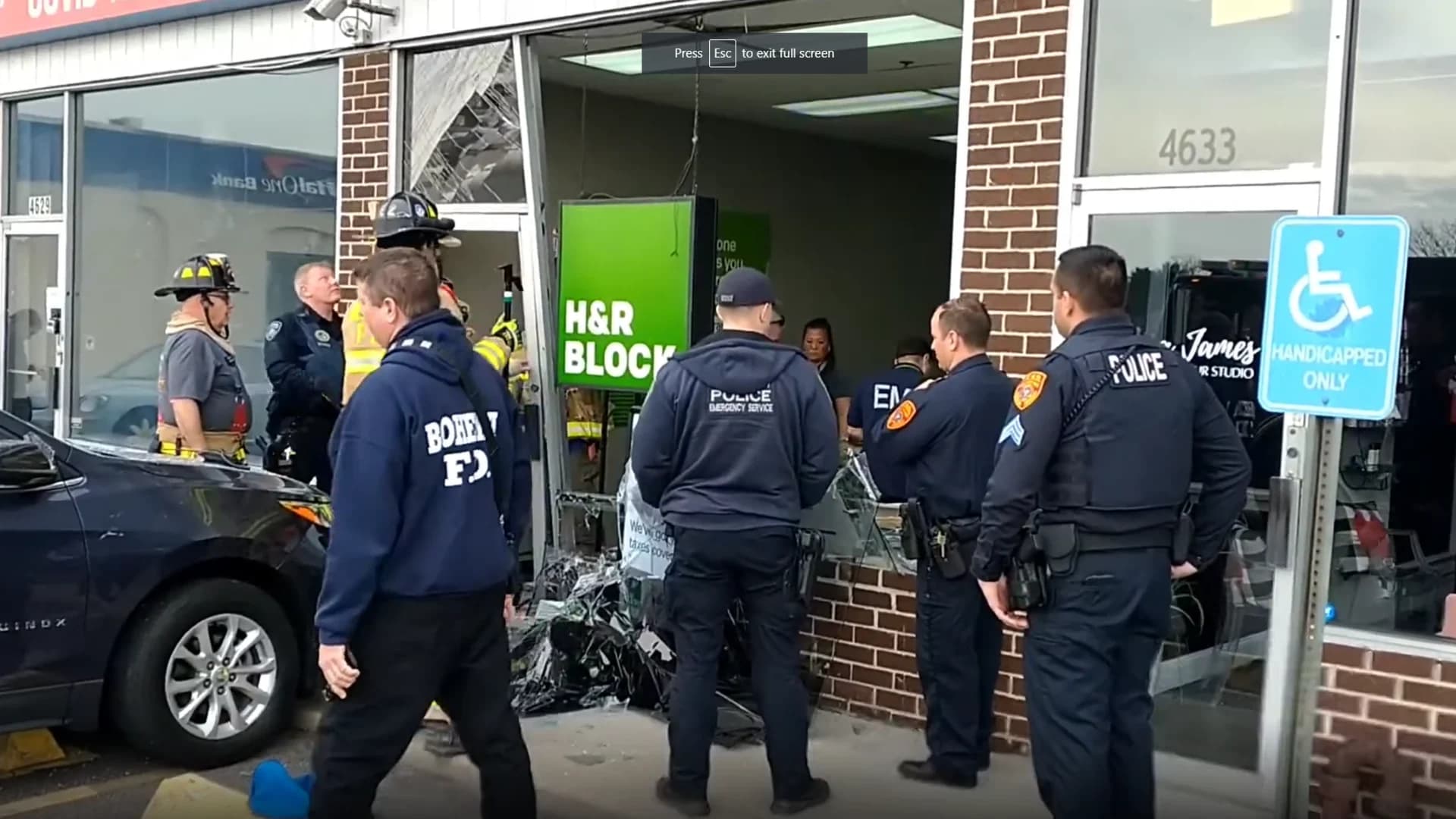 Police: 2 injured after woman drives SUV into H&R Block in Bohemia